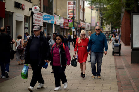 People walk along Chatham High Street in Chatham, Britain, August 8, 2017. REUTERS/Hannah McKay