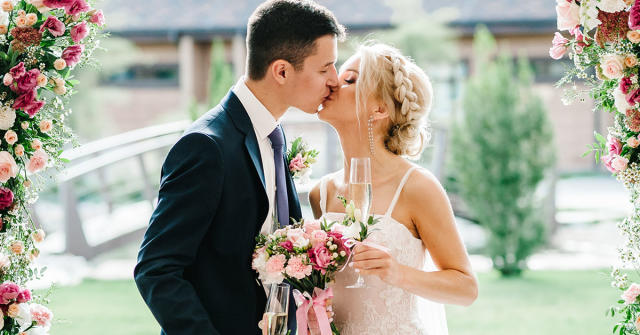 Bride and groom kissing at their wedding