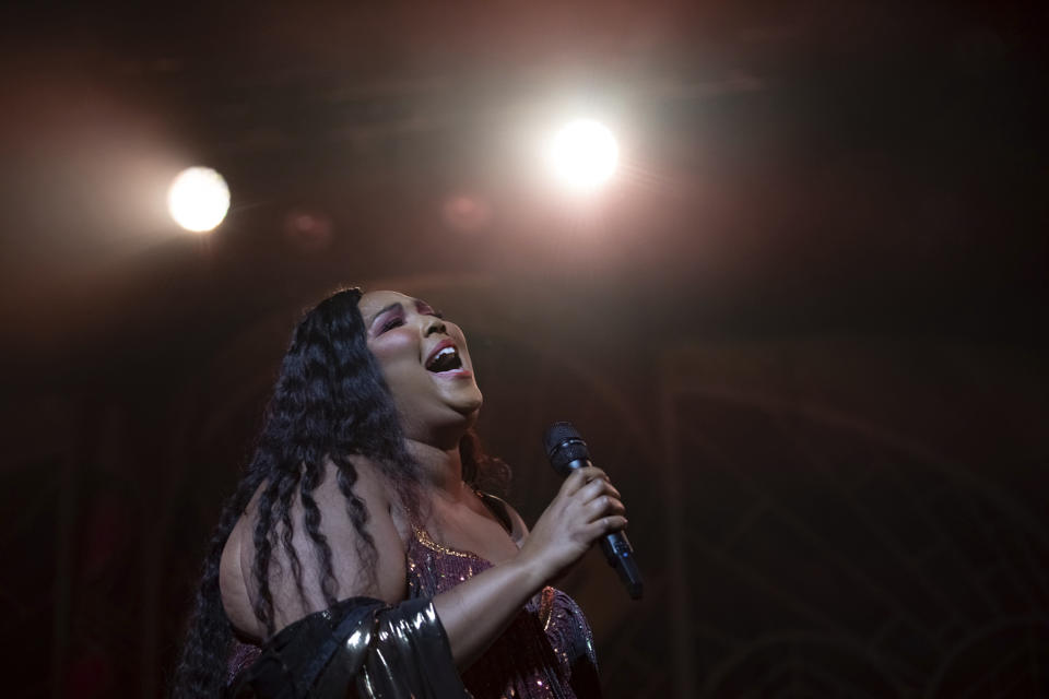 FILE - This Sept. 25, 2019 file photo shows Lizzo performing in Washington. Lizzo has been named Entertainer of the Year by The Associated Press. Voted by entertainment staffers of the news cooperative, Lizzo dominated the pop, R&B and rap charts in 2019 with songs like “Truth Hurts" and “Good As Hell." Though she released her first album in 2013, Lizzo dropped her major-label debut, “Cuz I Love You,” this year and the success has made her the leading nominee at the 2020 Grammy Awards, where she is up for eight honors. (Photo by Brent N. Clarke/Invision/AP, File)