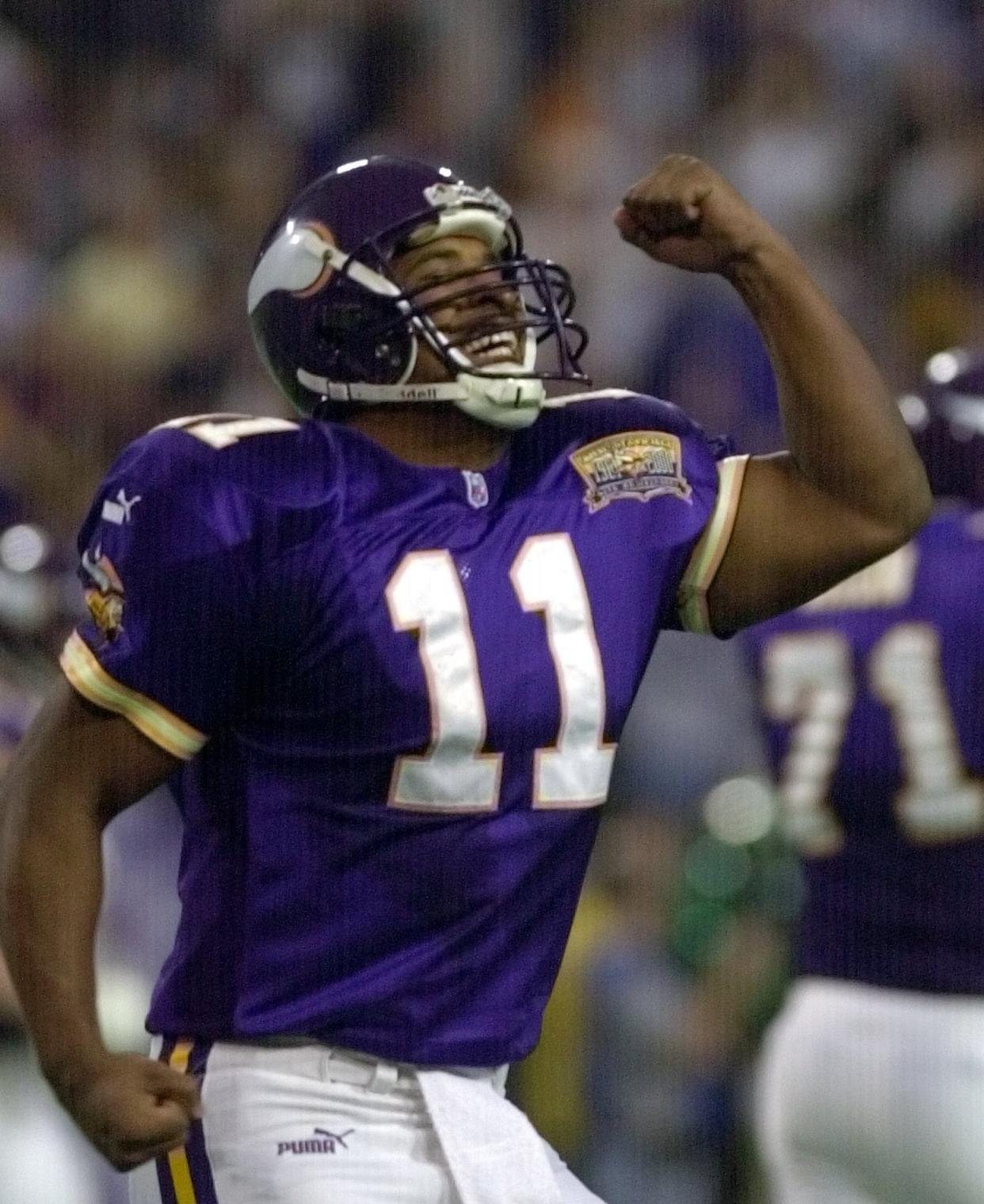 Minnesota Vikings quarterback Daunte Culpepper celebrates his 68-yard touchdown pass to Randy Moss in the third quarter of the Vikings playoff game against the New Orleans Saints Saturday, Jan. 6, 2001, in Minneapolis.