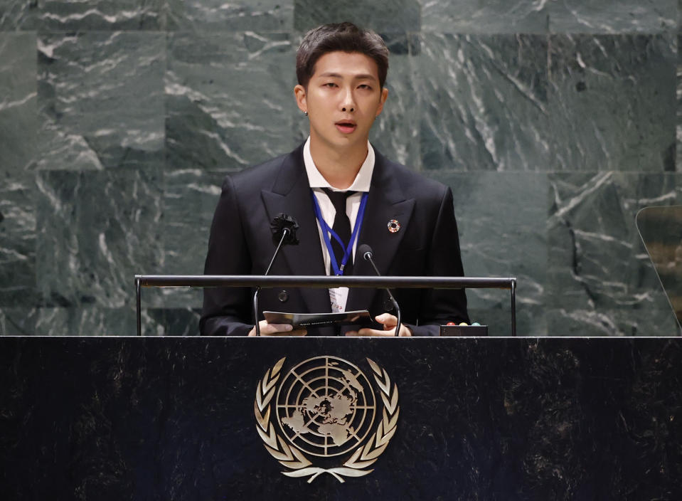 FILE - RM, of the South Korean K-pop band BTS, speaks at the Sustainable Development Goals meeting during the 76th session of the United Nations General Assembly, at the United Nations Headquarters on Sept. 20, 2021. Three members of the K-pop superstar group BTS have been infected with the coronavirus. the Big Hit Entertainment agency says in a statement that RM and Jin were diagnosed with COVID-19 on Saturday evening. It earlier said another member, Suga, tested positive for the virus on Friday. (John Angelillo/Pool Photo via AP, File)