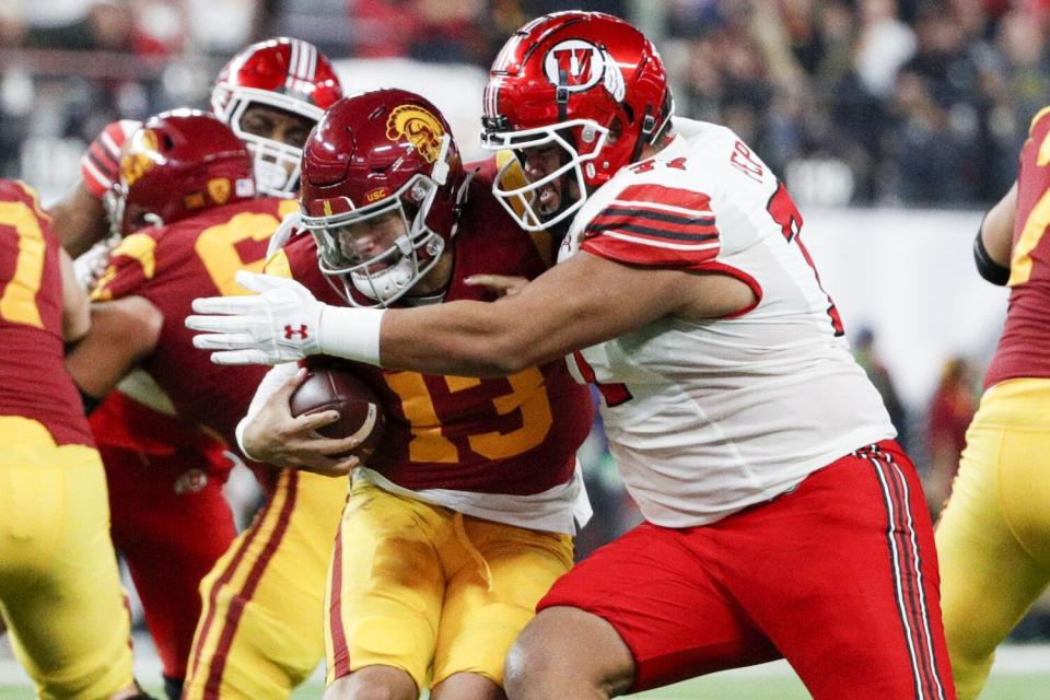 Utah defensive tackle Simote Pepa sacks USC quarterback Caleb Williams during the third quarter.