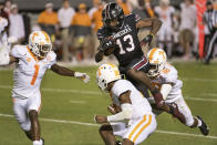 South Carolina wide receiver Shi Smith (13) scores a touchdown against Tennessee's Doneiko Slaughter (18), Trevon Flowers (1) and Bryce Thompson (0) during the second half of an NCAA college football game Saturday, Sept. 26, 2020, in Columbia, S.C. (AP Photo/Sean Rayford)