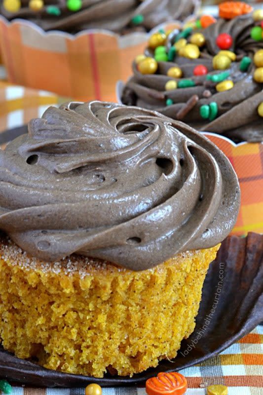 <p>Lady Behind the Curtain</p><p>Pumpkin cupcakes have added crunchy tops dipped in melted butter and a cinnamon sugar mixture with a cinnamon-chocolate cream cheese frosting.</p><p><strong>Get the recipe: </strong><a href="https://www.ladybehindthecurtain.com/pumpkin-churro-cupcakes-with-cinnamon-chocolate-frosting-behind-the-curtain-dessert-challenge/" rel="nofollow noopener" target="_blank" data-ylk="slk:Pumpkin Churro Cupcakes;elm:context_link;itc:0;sec:content-canvas" class="link rapid-noclick-resp"><strong>Pumpkin Churro Cupcakes</strong></a></p>