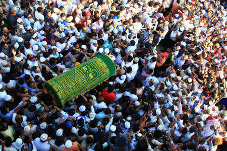 Supporters carry the coffin of Ko Ni, a prominent member of Myanmar's Muslim minority and legal adviser for Myanmar's ruling National League for Democracy, after he was shot dead, in Yangon, Myanmar. REUTERS/Mg Nyi Nyi