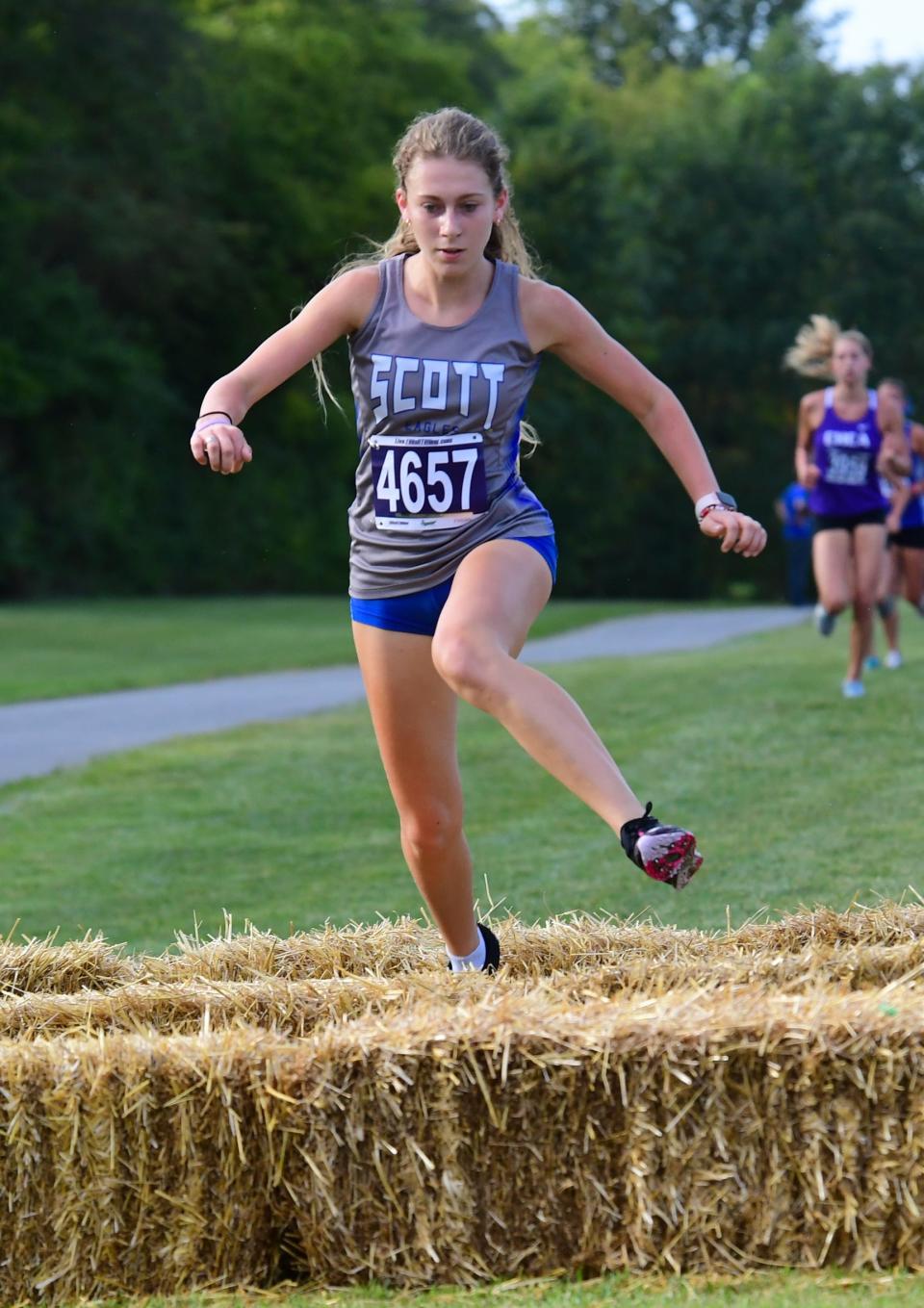 Maddie Strong, shown winning the Mason Invitational in September, won the 2A state cross country title Friday.
