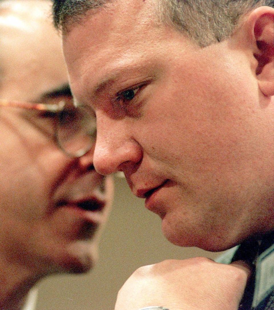 Assistant State Attorney Charlie Roberts, left, speaks with Jamie Bellush during day three of Daniel Rocha's trial for first-degree murder and conspiracy to commit murder, in the death of Jamie's wife Sheila Bellush, of Sarasota, in 1997.