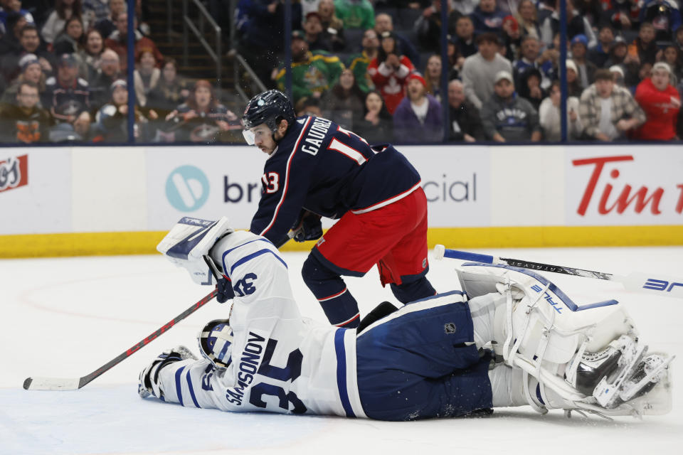 Columbus Blue Jackets' Johnny Gaudreau, top, scores against Toronto Maple Leafs' Ilya Samsonov during overtime in an NHL hockey game Friday, Dec. 29, 2023, in Columbus, Ohio. (AP Photo/Jay LaPrete)