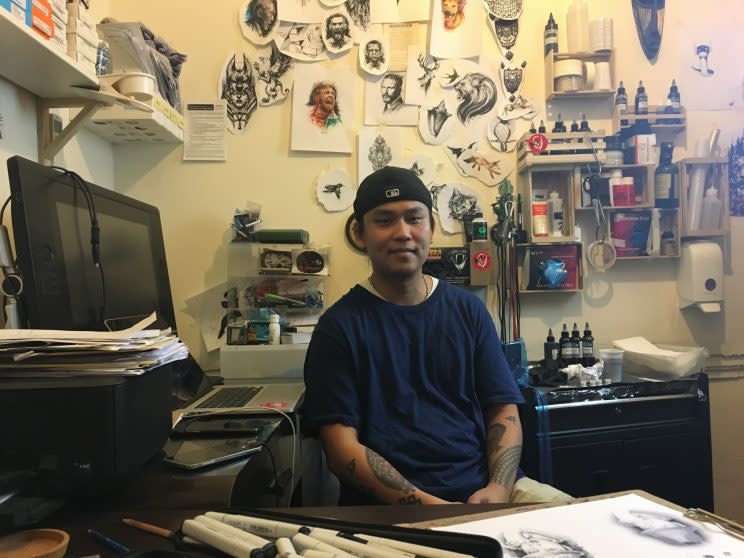 Realism tattoo artist Ael Lim sits at his personal workstation within his tattoo studio, which is located at Pearl's Hill Terrace. He runs Imagine Tattoo Studio. (Photo: Yahoo Lifestyle Singapore).