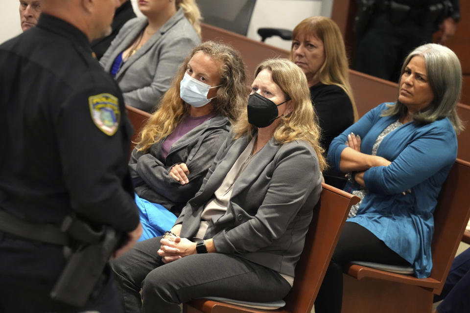 Capt. Nicholas Mazzei of the Coral Springs Police Department, walks past victims' family members after testifying on the scene he encountered at the school after the mass shooting during the penalty phase of Marjory Stoneman Douglas High School shooter Nikolas Cruz's trial, Friday, July 22, 2022, at the Broward County Courthouse in Fort Lauderdale, Fla. Cruz previously plead guilty to all 17 counts of premeditated murder and 17 counts of attempted murder in the 2018 shootings. (Mike Stocker/South Florida Sun-Sentinel via AP, Pool)