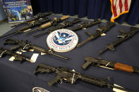 Firearms are displayed during a news conference at the Homeland Security Investigations Miami Field Office (HSI), Wednesday, Aug. 17, 2022, in Miami. HSI is working with other agencies to highlight efforts to crack down on a recent increase of firearms and ammunition smuggling to Haiti and other Caribbean nations. (AP Photo/Lynne Sladky)