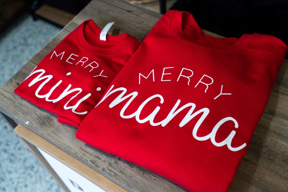 A holiday set of shirts shown as a gift item for holiday shoppers at the space for Dcreated Boutique in the Downtown Detroit Markets located at Cadillac Square in downtown Detroit on Wednesday, November 30, 2022.