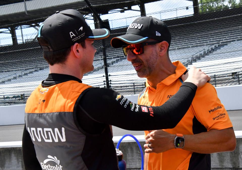 Arrow McLaren SP driver Pato O'Ward (5) talks with Tony Kanaan on Saturday, Aug. 12, 2023, ahead of the Gallagher Grand Prix at Indianapolis Motor Speedway.