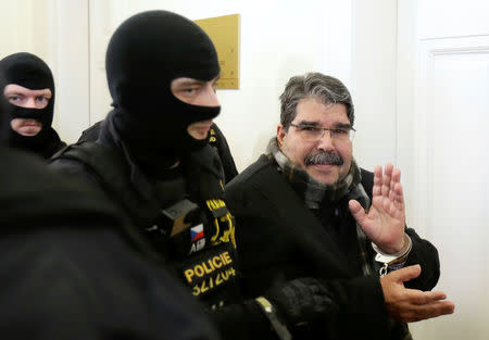 Kurdish Democratic Union Party (PYD) former leader Saleh Muslim is escorted to a Czech court, which will rule on his custody pending extradition proceedings requested by Turkey, in Prague, Czech Republic, February 27, 2018. REUTERS/David W Cerny