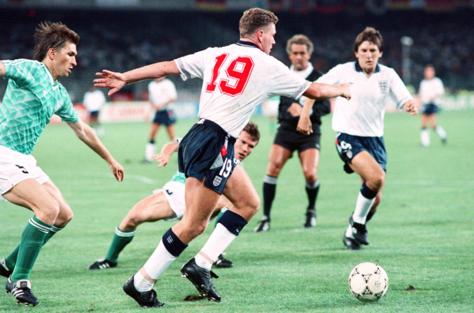 <p> 1990 World Cup Semi Final match the Stadio delle Alpi in Turin, Italy. West Germany 1 v England 1 (west Germany won on penalties). England&apos;s Paul Gascoigne steps away from Klaus Augenthaler (left) and Lothar Mattheus during the match watched by Peter Beardsley, 4th July 1990. </p> <p> Back in the day, players would wear 1-11. Certainly, England stars would. Paul Gascoigne was the first of a generation to make the No.19 iconic. </p> <p> Gazza&apos;s sumptuous Italia 90 performances came with the number on his back, despite the Geordie genius getting No.8 at Euro 96. Whether it was worn by Santi Cazorla, Leroy San&#xE9;, Mario Gotze or Lionel Messi himself, there&apos;s always been a mercurial streak about most No.19s since.&#xA0; </p>