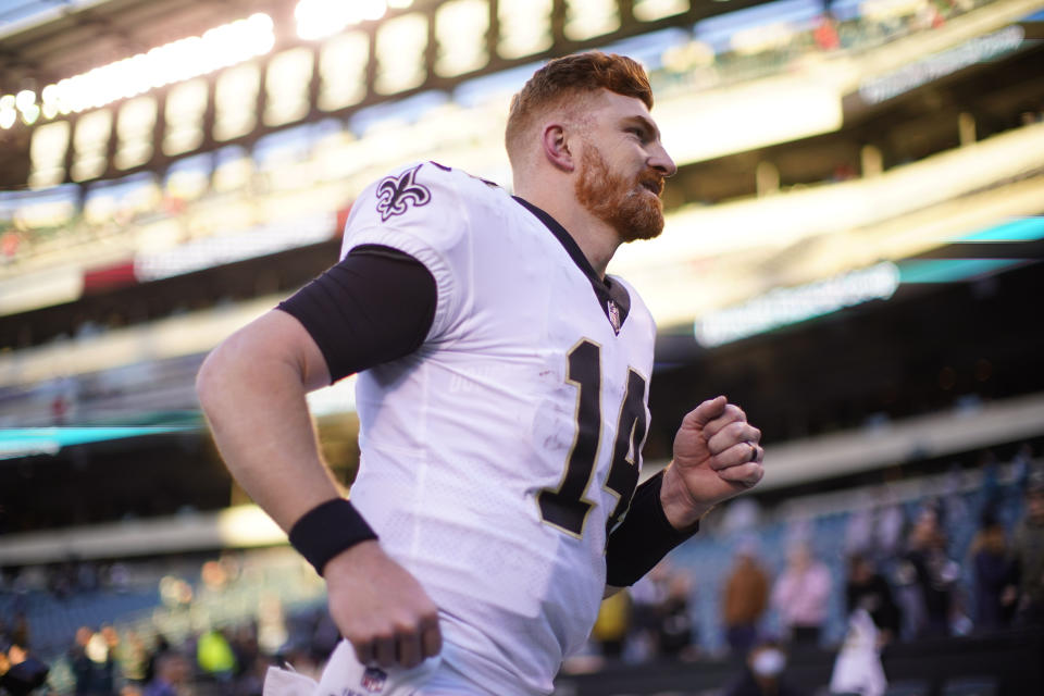 New Orleans Saints quarterback Andy Dalton (14) runs off the field after an NFL football game against the Philadelphia Eagles in Philadelphia, Sunday, Jan. 1, 2023. The Saints won 20-10. (AP Photo/Matt Rourke)