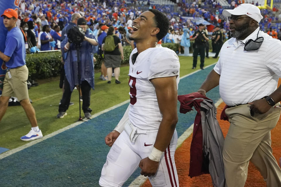 Alabama quarterback Bryce Young celebrates in front of fans as he leaves the field after defeating Florida in an NCAA college football game, Saturday, Sept. 18, 2021, in Gainesville, Fla. (AP Photo/John Raoux)