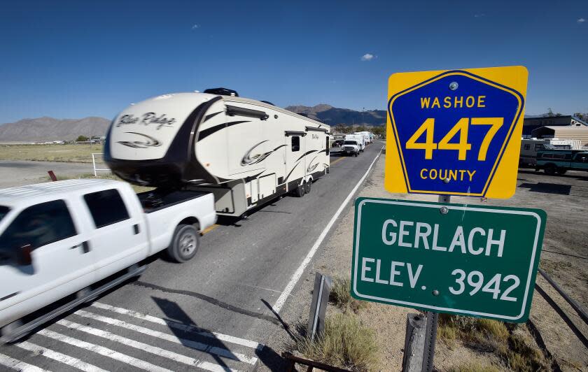 Trucks with trailers travel along county highway 447 through Gerlach, Nev. in route to the Black Rock Desert Tuesday, Aug. 23, 2016. Seventy thousand people are expected to travel though the small and quiet northern Nevada town in route to the annual counterculture Burning Man festival. (David Becker/ For the Times)