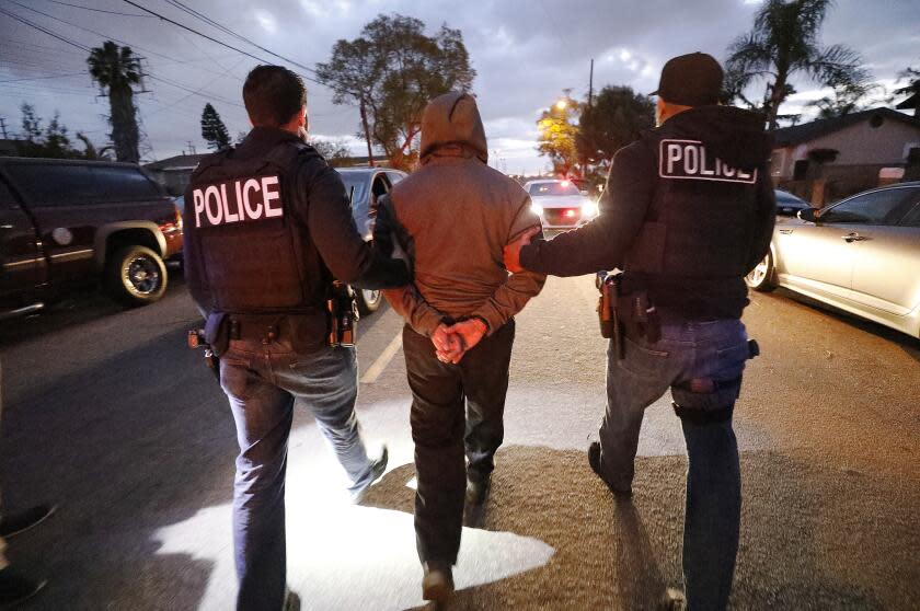 U.S. Immigration and Customs Enforcement (ICE) agents joined by (CBP) U.S. Customs & Border Protection agents take Marcos Correa into custody as ICE officers are joined by CBP agents in the last few weeks, as more resources are deployed in sanctuary cities.