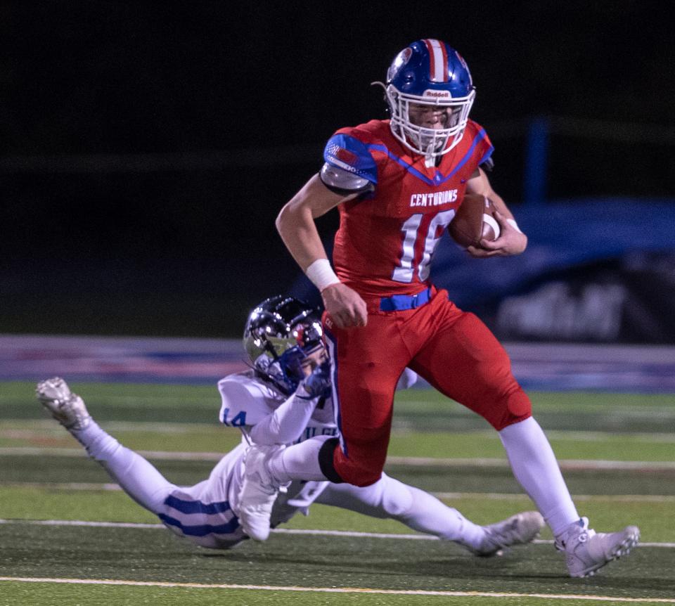 Christian Academy of Louisville's Gavin Copenhaver eludes a Paducah Tilghman tackler during first half action at CAL. Nov 19, 2021