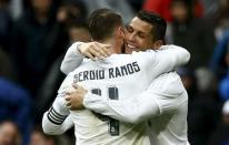 Football Soccer - Real Madrid v Athletic Bilbao - Spanish Liga BBVA - Santiago Bernabeu stadium, Madrid, Spain - 13/02/16 Real Madrid's Cristiano Ronaldo (R) celebrates his second goal with teammate Sergio Ramos. REUTERS/Andrea Comas