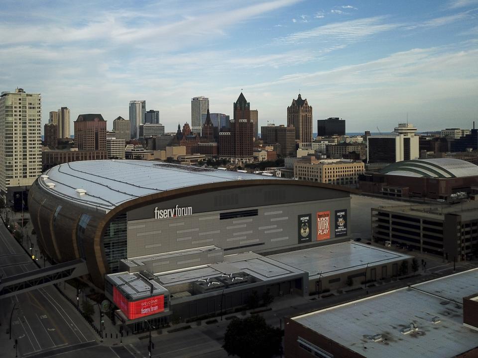 FILE - In this July 29, 2020 file photo, The Fiserv Forum is seen in Milwaukee. Election officials said Tuesday, Oct. 6, 2020, that they scrapped their plans to use the Milwaukee Bucks and Brewers' stadiums as early voting sites in the presidential battleground state of Wisconsin. Milwaukee's election commission had planned to use Fiserv Forum and Miller Park between Oct. 20 and Nov. 1 as sites where people could have voted early in-person or returned absentee ballots they received by mail. The commission developed the plan in an effort to provide safe voting sites during the coronavirus pandemic. (AP Photo/Morry Gash File)