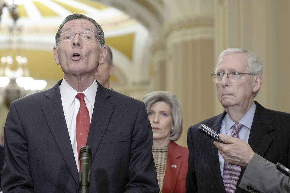 Senator John Barrasso, R-Wyo., left, talks after a policy luncheon on Capitol Hill Tuesday, Feb. 27, 2024, in Washington. (AP Photo/Mariam Zuhaib)