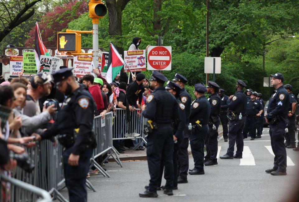 Police face pro-Palestinian demonstrators near the Met Gala (AFP via Getty Images)