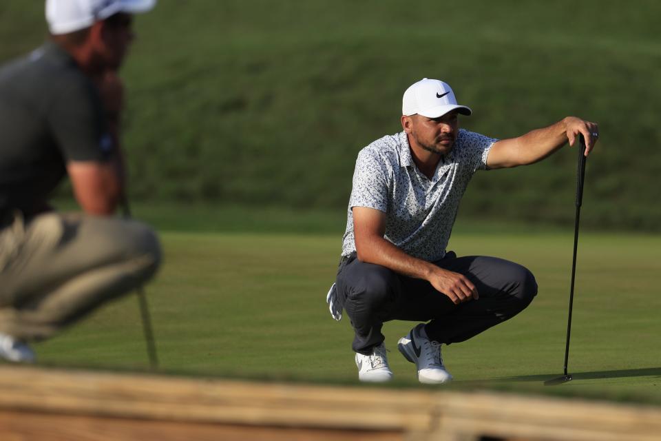 Jason Day looks over his putt at No. 16 of the Players Stadium Course during the second round of The Players Championship on Friday.