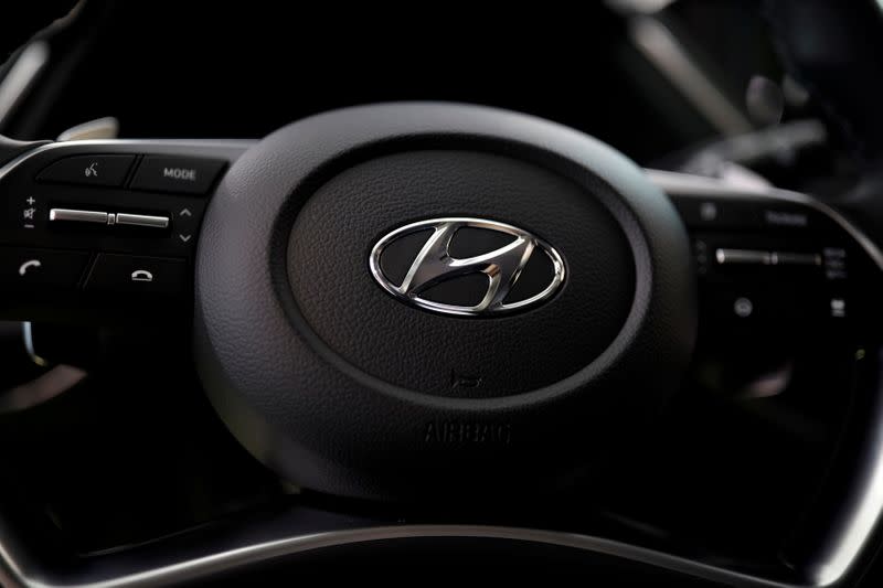 FILE PHOTO: The logo of Hyundai Motors is seen on a steering wheel of a all-new Sonata sedan on display at the company's headquarters in Seoul