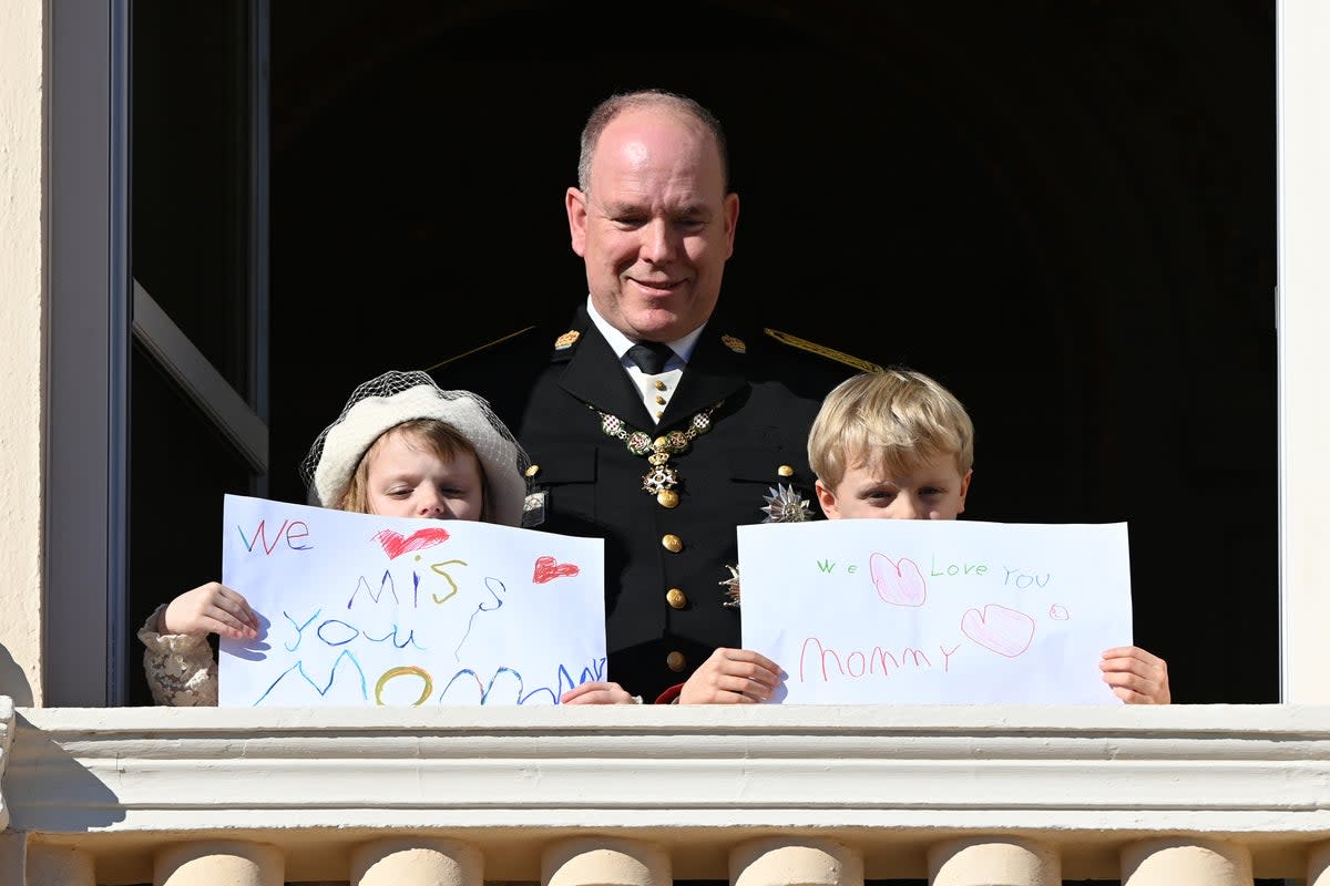 Princess Gabriella and Prince Jacques show their drawings on the Palace balcony during Monaco National Day Celebrations on 19 November 2021 (Getty Images)