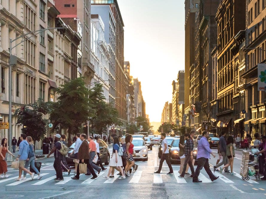 People walk in a New York City crosswalk.