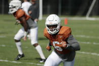 Texas wide receiver Devin Duvernay (6) goes through drills during a morning practice at the NCAA college football team's facility in Austin, Texas, Wednesday, Aug. 7, 2019. (AP Photo/Eric Gay)