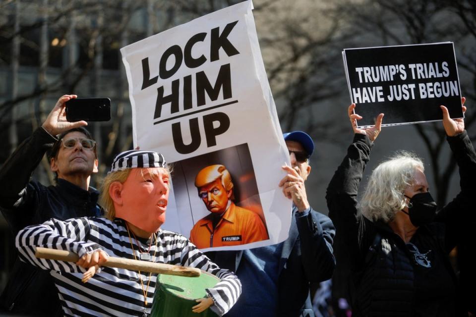 Anti-Trump protesters demonstrate outside Manhattan Criminal Courthouse (Reuters)