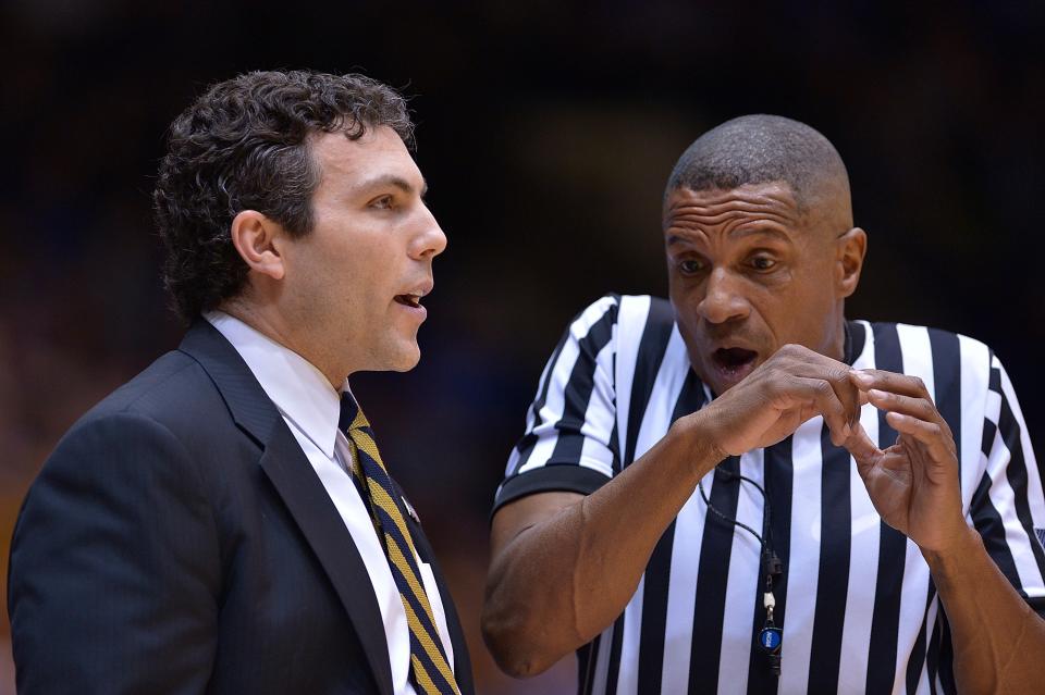 Referee Ted Valentine talks with Georgia Tech’s Josh Pastner during the game against Duke earlier this season. (Getty)