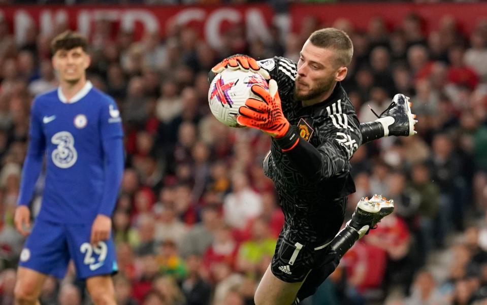 Manchester United's goalkeeper David de Gea makes a save during the English Premier League soccer match between Manchester United and Chelsea - AP Photo/Dave Thompson