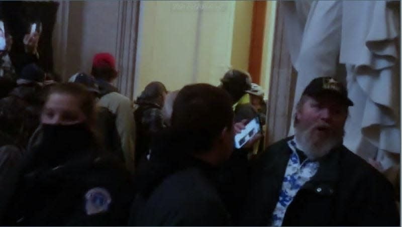 Edward T. Spain Jr., right, is seen inside the U.S. Capitol in this photo provided to the FBI during its investigation of the Jan. 6, 2021, riot.