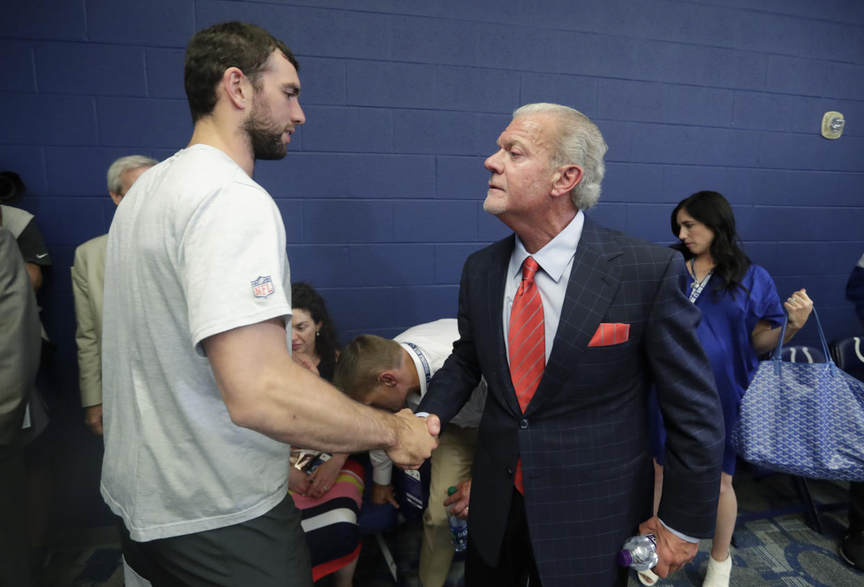 FILE - Indianapolis Colts quarterback Andrew Luck shakes hands with Indianapolis Colts owner Jim Irsay after a news conference following the team's NFL preseason football game against the Chicago Bears, Saturday, Aug. 24, 2019, in Indianapolis. The Indianapolis Colts want other NFL teams to know they consider contacting former quarterback Andrew Luck or his representatives tampering. Team owner Jim Irsay made it clear a Twitter post late Sunday night, May 7, 2023, following a weekend report from ESPN that the Washington Commanders attempted to find out in 2022 whether the four-time Pro Bowler would consider making a comeback. (AP Photo/Michael Conroy, File)