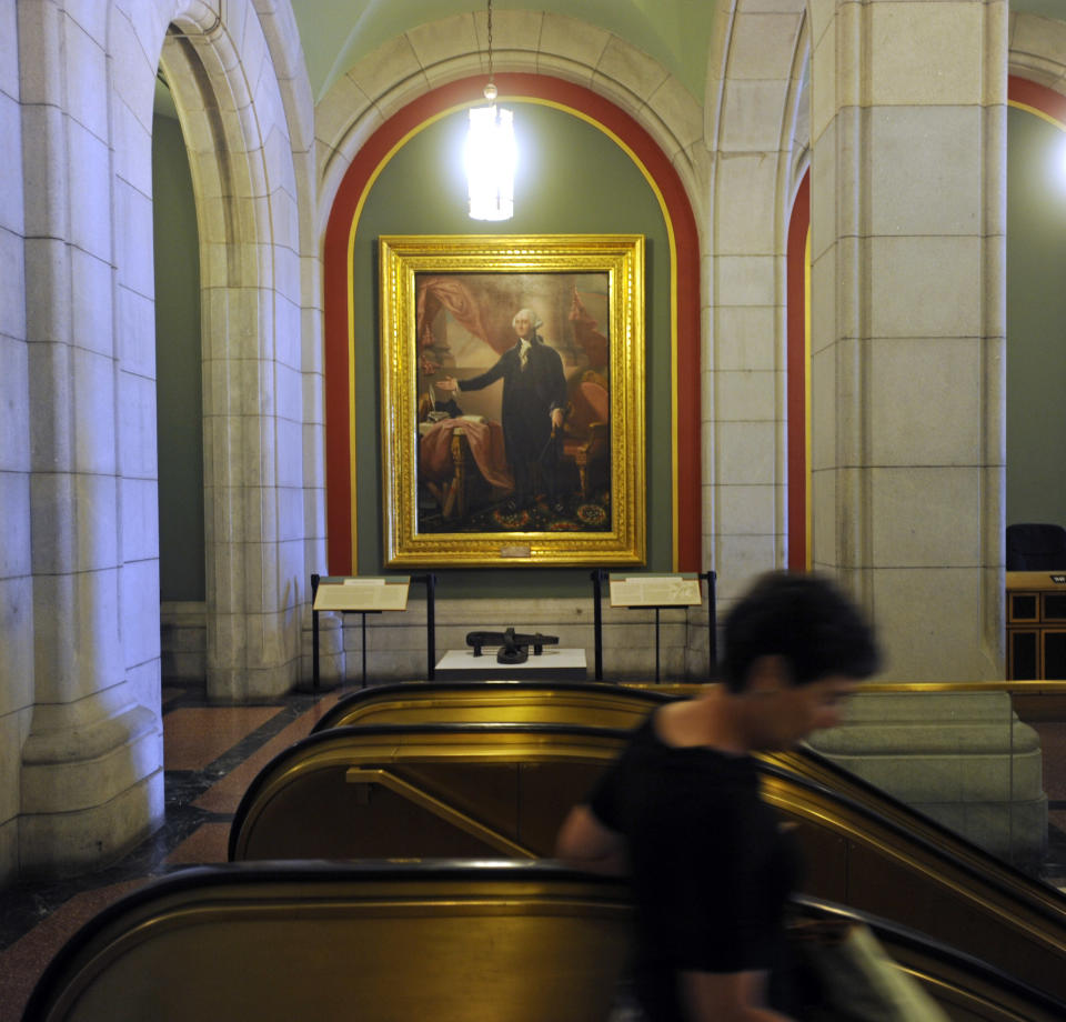 In this July 31, 2012 photo, a portrait of George Washington adorns a lobby at the Capitol in Albany, N.Y. Historic artifacts that have been kept in storage for years are now on display in the corridors of the Capitol and the adjacent Empire State Plaza. (AP Photo/Tim Roske)