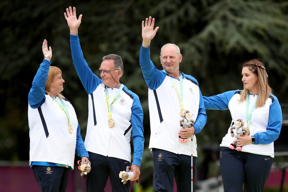 George Miller (second left) celebrates his historic Commonwealth Games gold medal (Isaac Parkin/PA) (PA Wire)