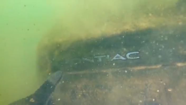 Mr Sides captured the underwater moment he discovered the Pontiac in which the Tennessee teens had last been spotted in 21 years ago (YouTube/Exploring With Nug)