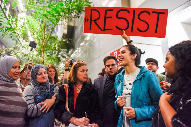 Niloofar Radgoudarzi thanking the crowd for protesting after her father was released from custody after being detained in San Francisco International Airport. (Photo: Kate Munsch/Reuters)