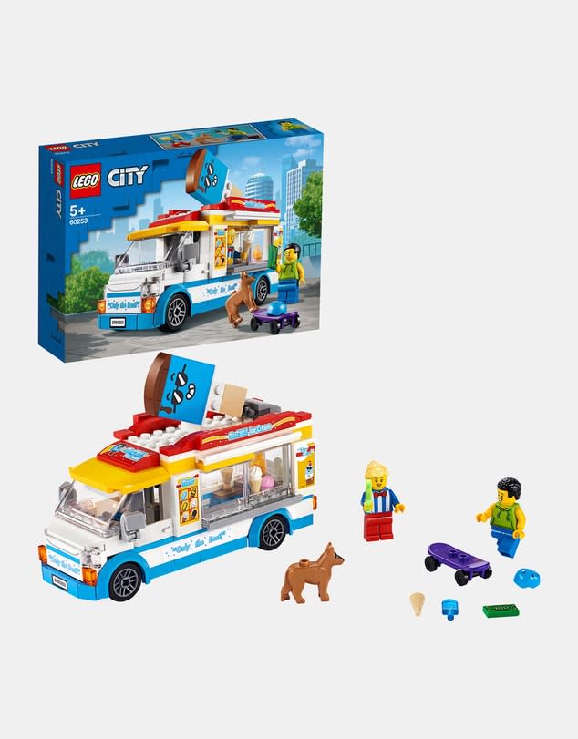 The packaging and constructed toy from a LEGO City Ice Cream Truck in white and bright primary colours with figures, dog and skateboard.