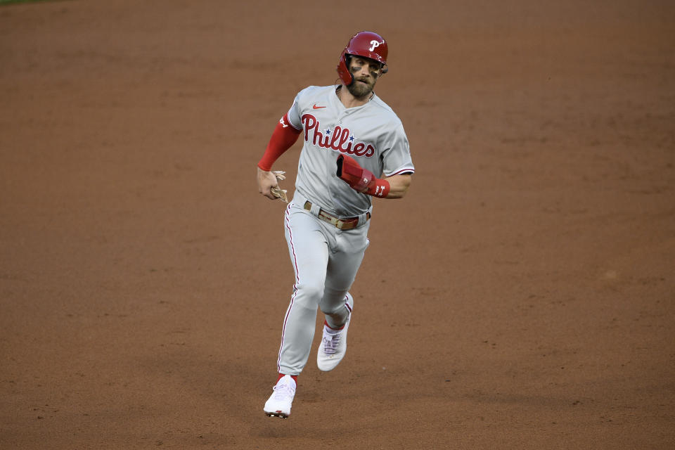 Philadelphia Phillies' Bryce Harper runs to third on a single by J.T. Realmuto during the third inning of the second baseball game of the team's doubleheader against the Washington Nationals, Tuesday, Sept. 22, 2020, in Washington. (AP Photo/Nick Wass)