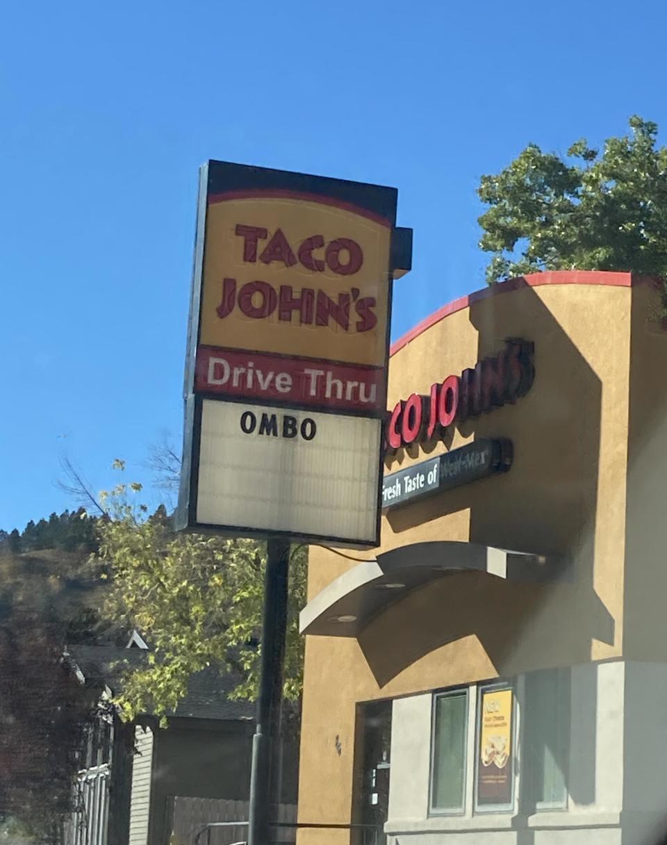 Taco john's sign reading ombo