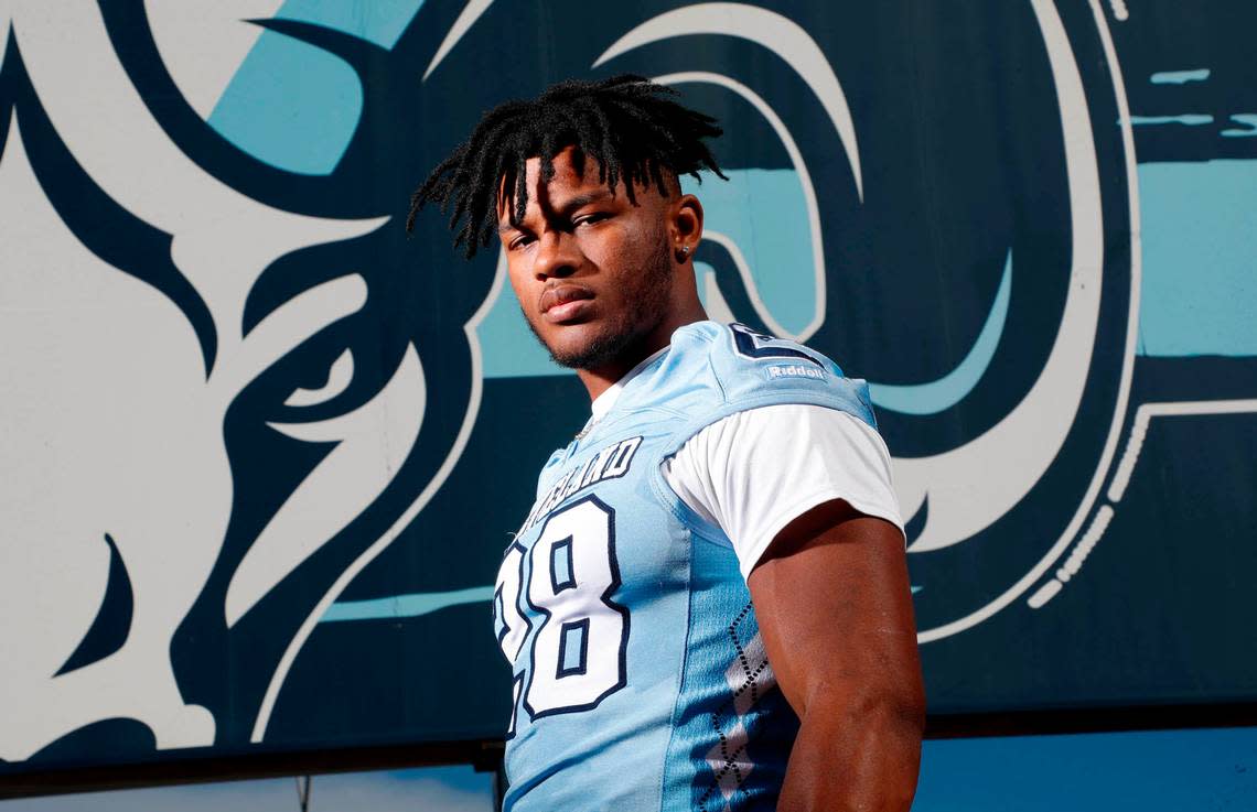 Omarion Hampton, running back at Cleveland High School in Clayton, N.C., poses outside the school on Wednesday, December 1, 2021.