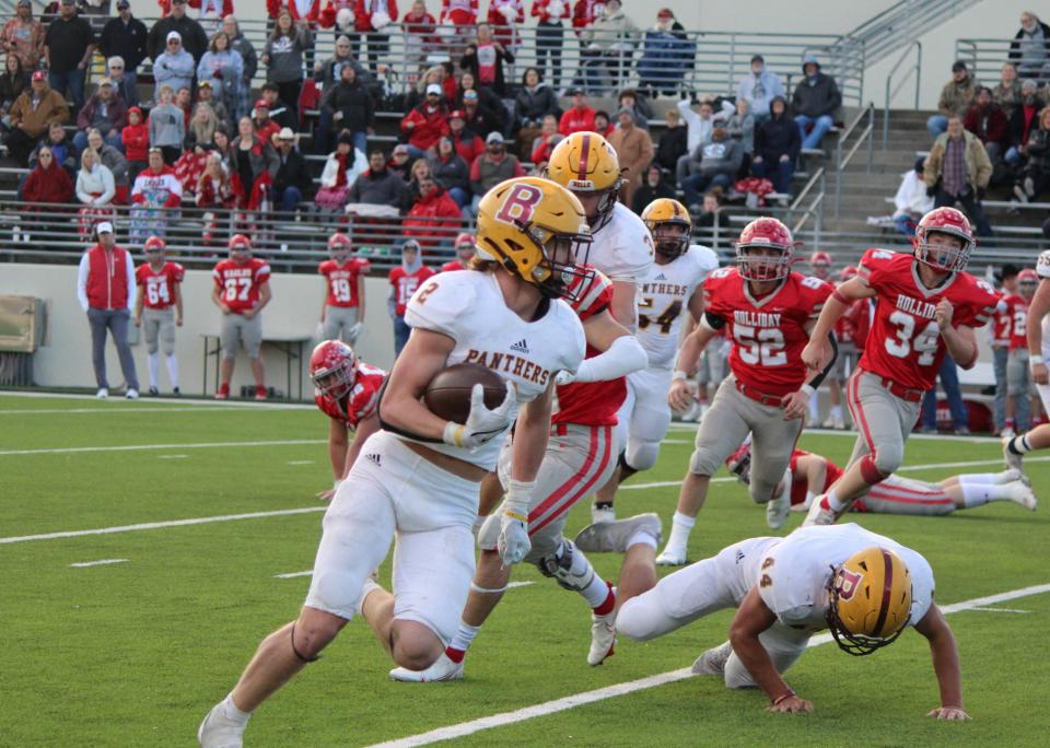 Bells' Bo Baker looks for running room in the Panthers' region semifinal loss against Holliday.