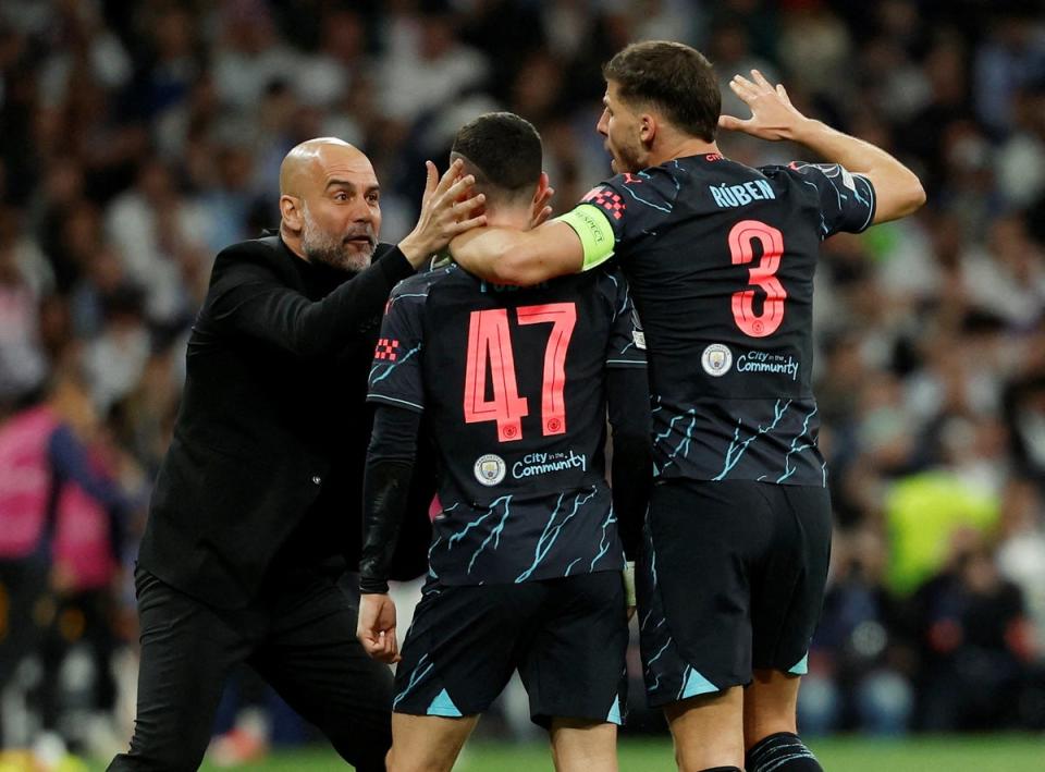 Pep Guardiola celebrates Phil Foden’s screamer at the Bernabeu  (Reuters)