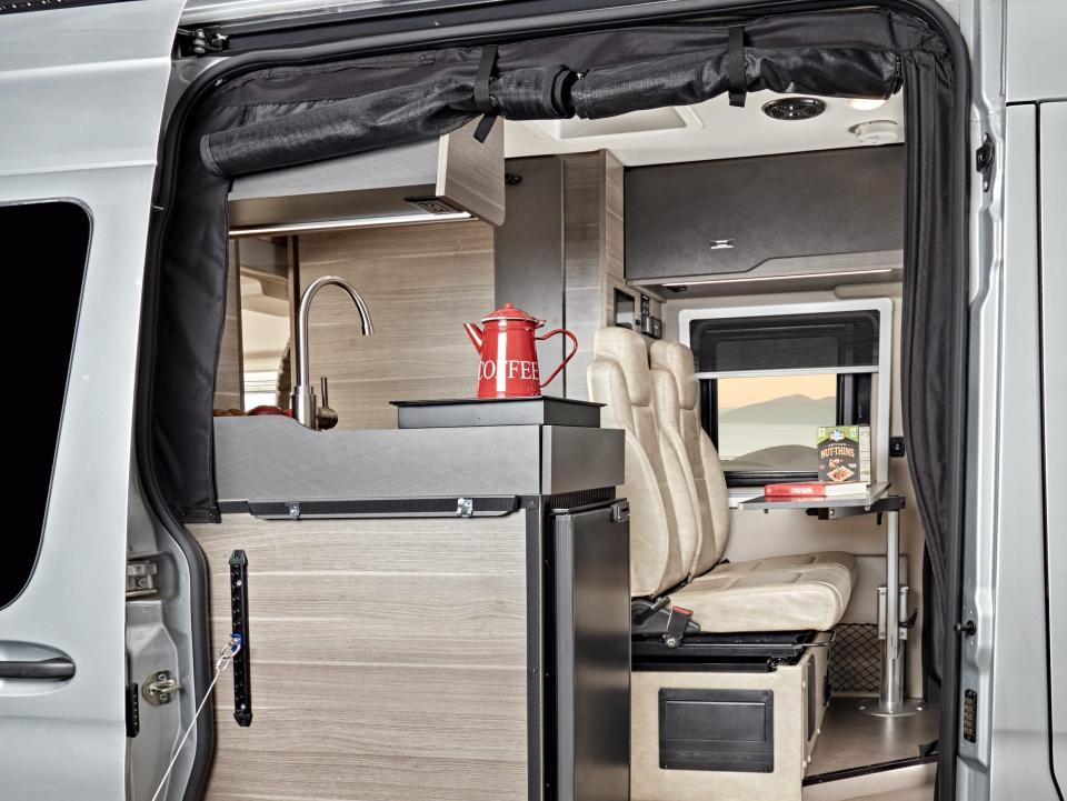 The exterior of the 2022 Jayco Terrain with the table extended out