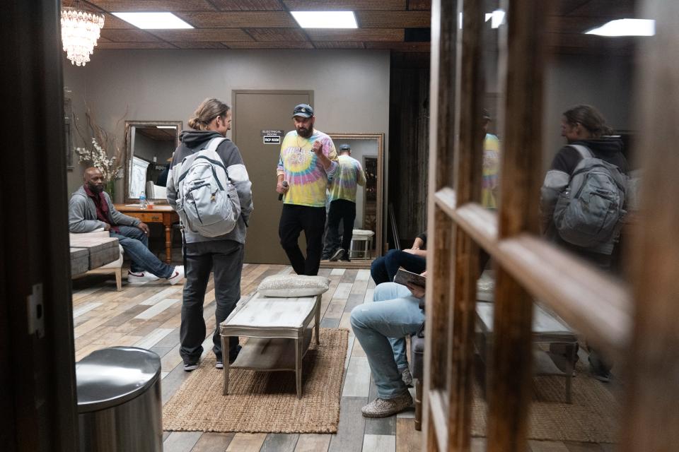 Before the show begins, Dan Shenck, middle, co-owner of Top City Comedy, meets with some of the comedians hanging out in the green room at The Foundry Event Center. Shenck, along with Vicki Trembly, started the comedy shows through their company in 2011.